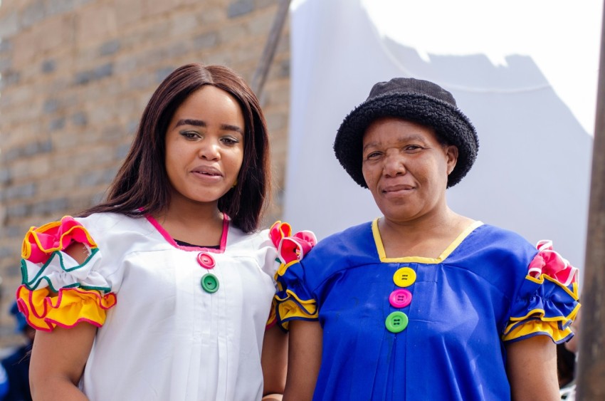 a couple of women standing next to each other