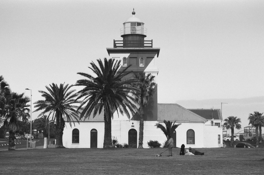 a black and white photo of a lighthouse