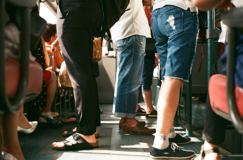 group of person sitting and standing inside the vehicle ABxVTtK