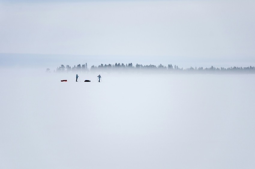 two persons standing on ice field XbIN03