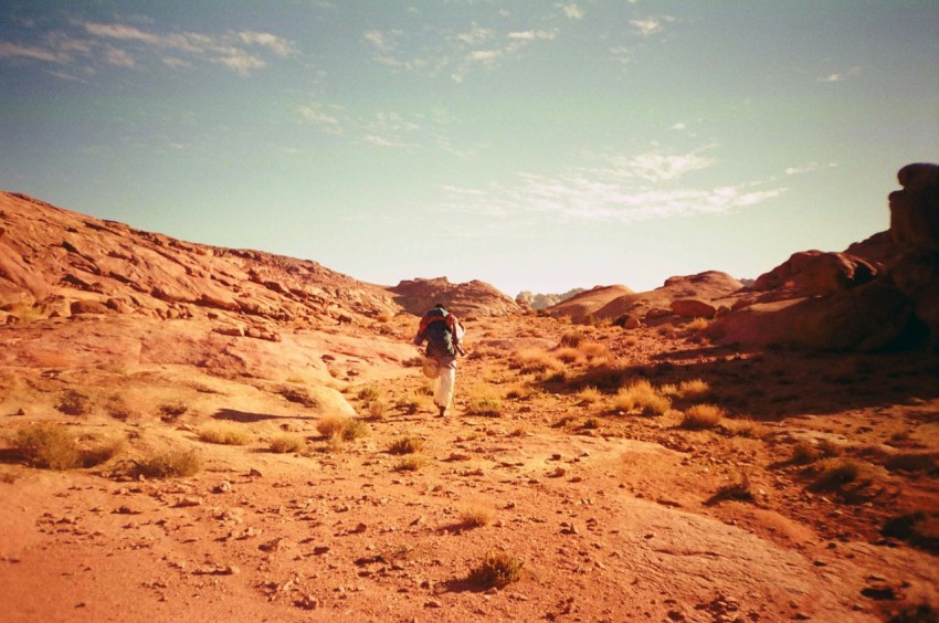 a person walking in a desert