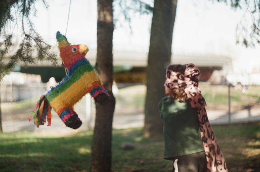 person hitting pinata