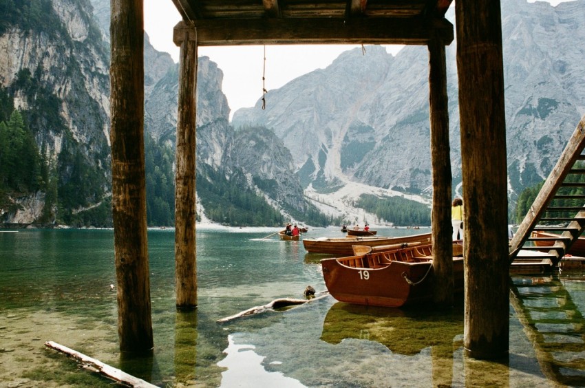 brown boat on body of water during daytime