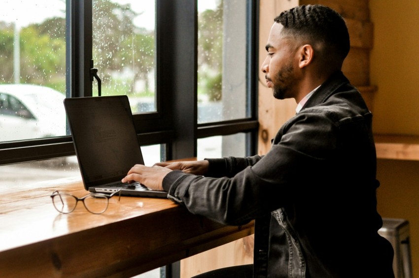 a man working on a laptop os7rk_Lh