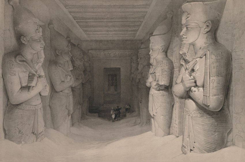 a black and white photo of a group of statues