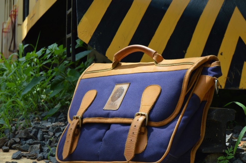 blue and brown leather satchel