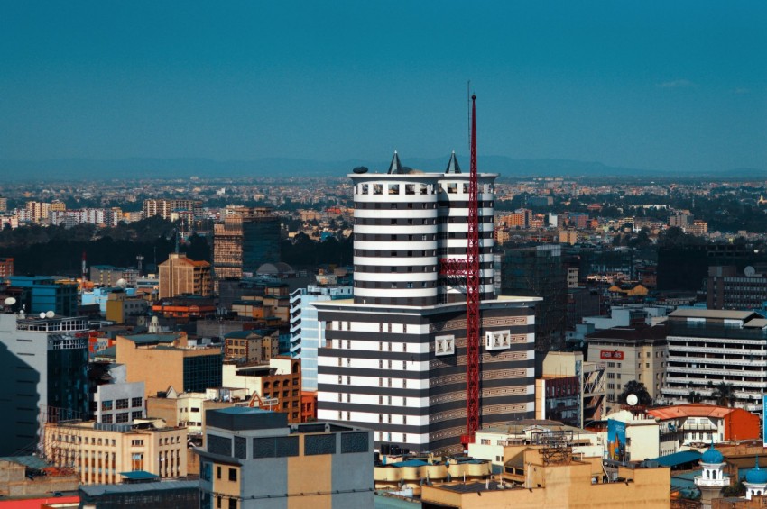 white and black concrete building under blue sky during daytime 1Uwcoo