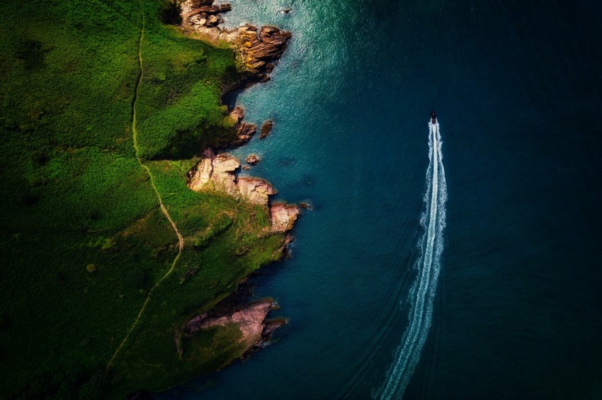 an aerial view of a boat in the water tB9ennZor