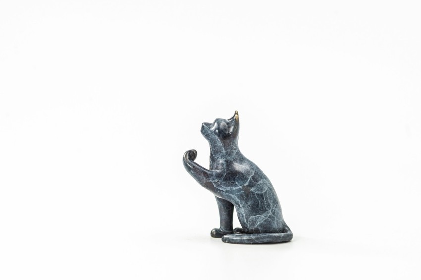 a statue of a cat on a white background