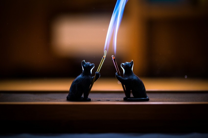 a couple of small figurines sitting on top of a table