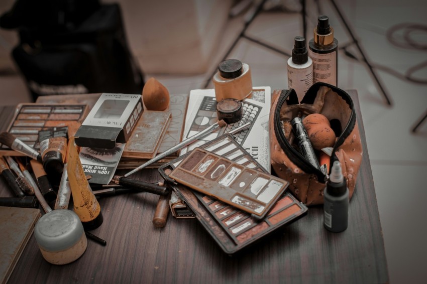 a wooden table topped with lots of different items