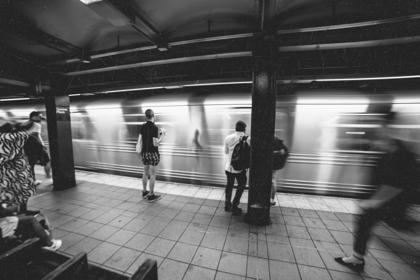 people standing on train station