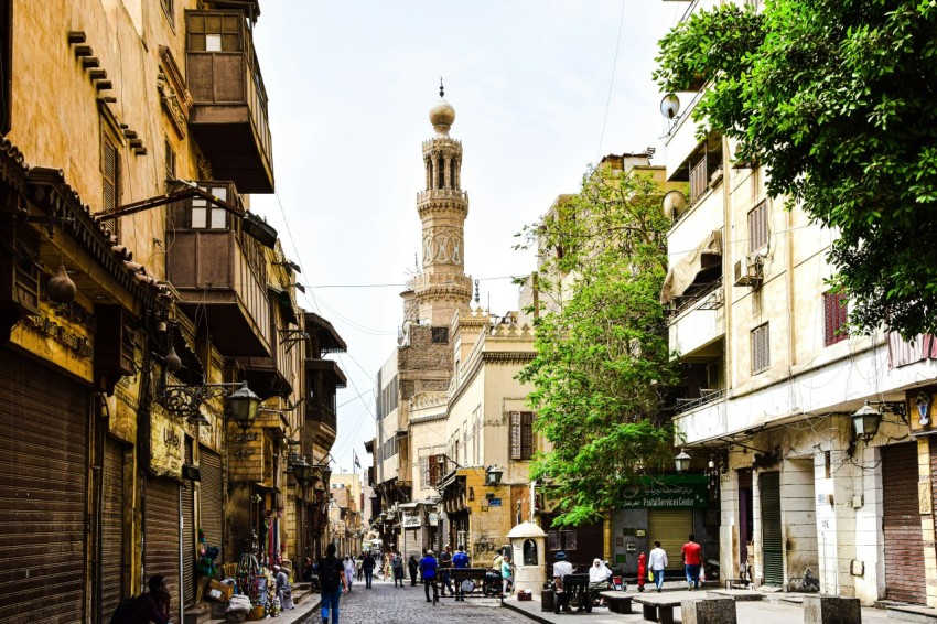 a street with buildings and people