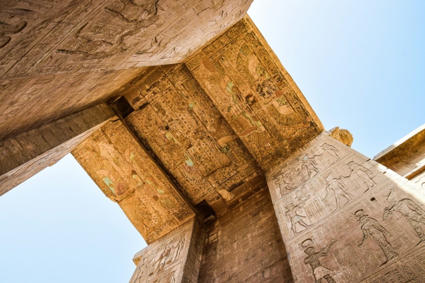 a tall building with carvings on the side of it