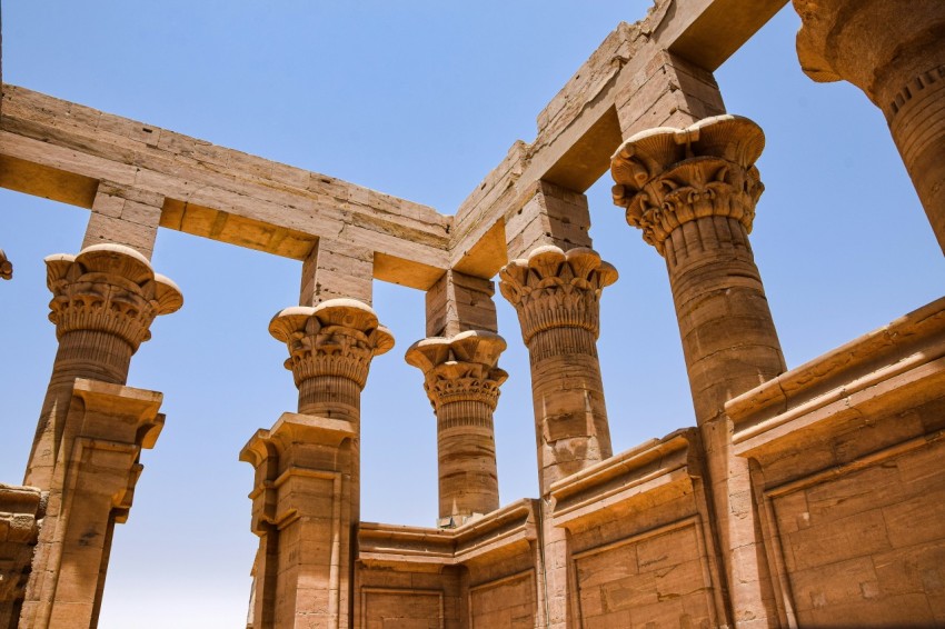 a group of stone pillars in a building riXsJp2