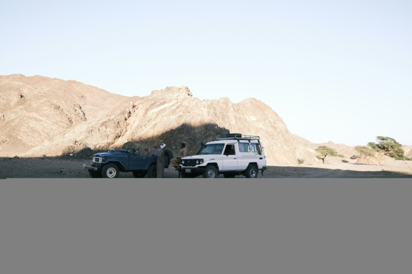 a group of people in a desert