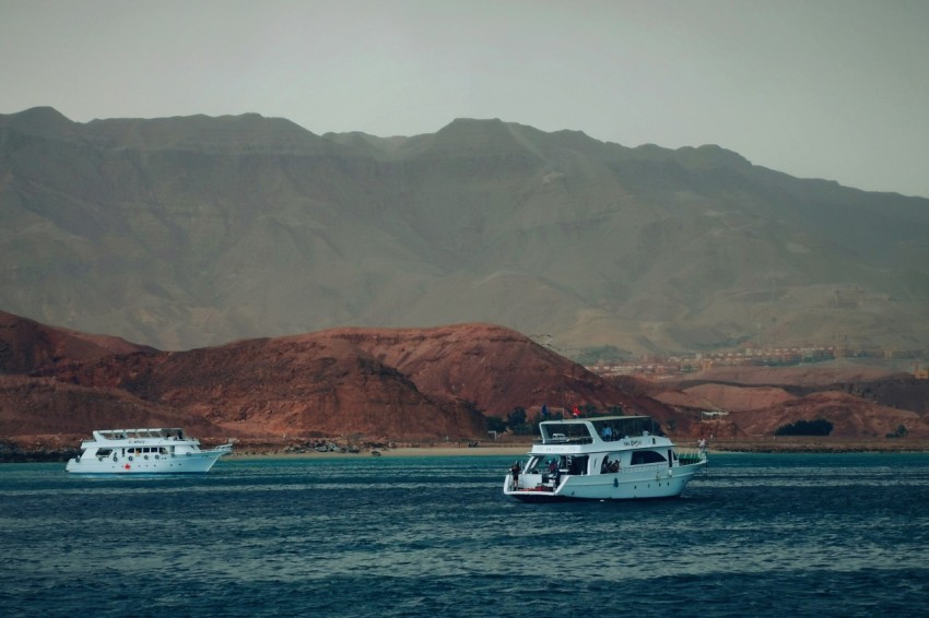 two white boats on ocean