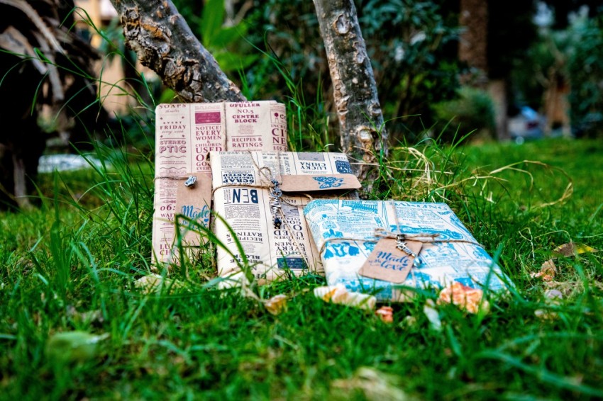 a pile of boxes in the grass