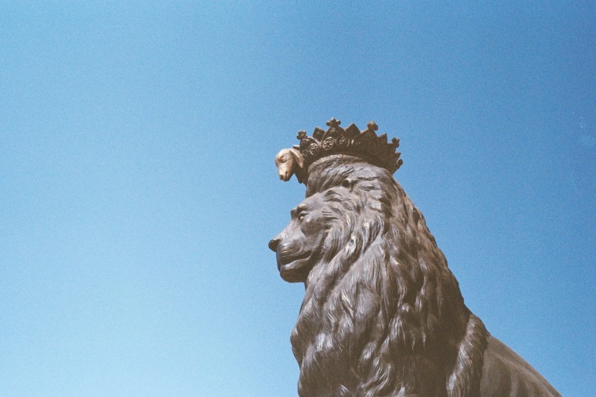 a statue of a lion with a crown on its head