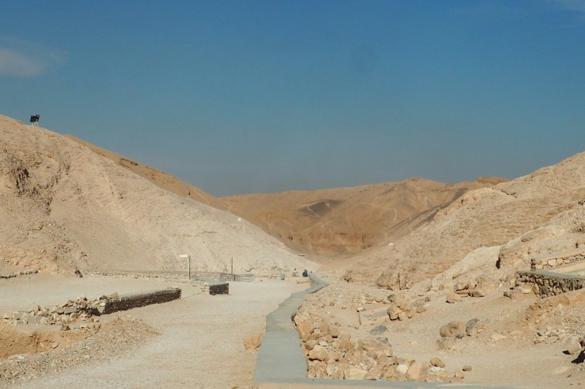 a dirt road in the middle of a desert