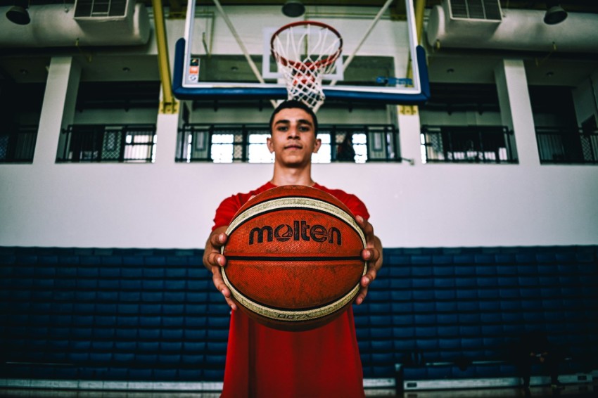 a person holding a basketball