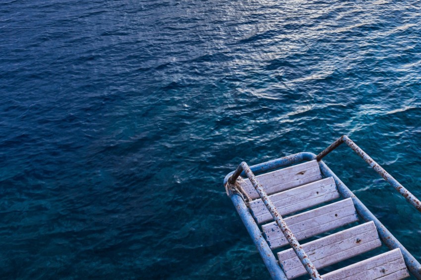 grey metal frame on blue sea