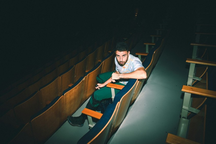 a man sitting on a slide DW