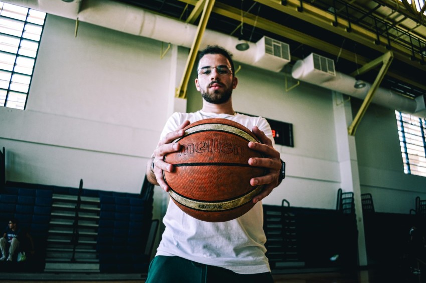 a man holding a basketball