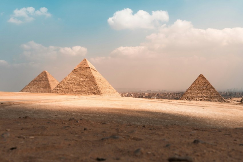 a group of pyramids in a desert