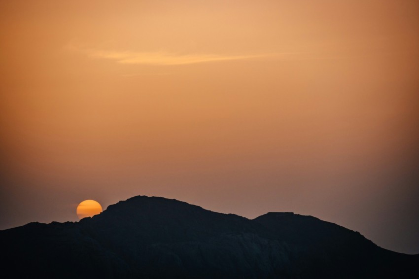 silhouette of mountain during sunset