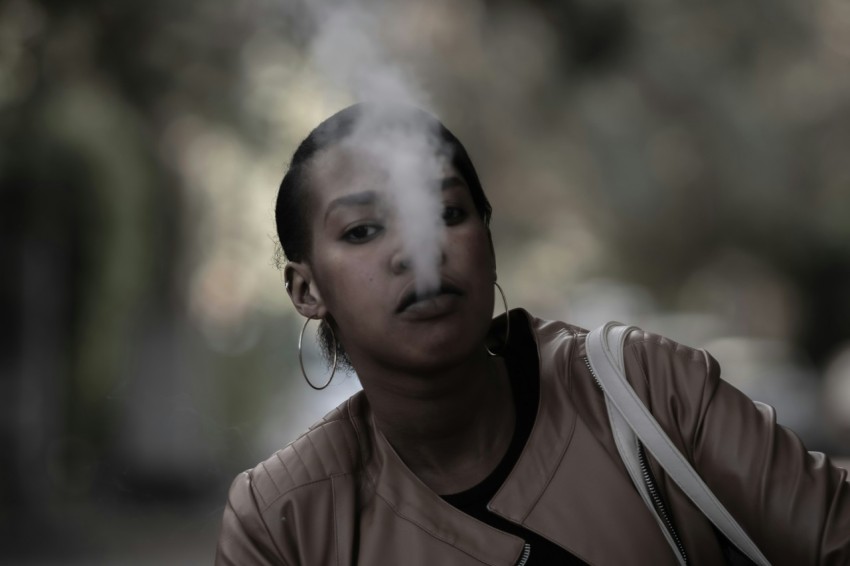 a woman with smoke coming out of her mouth w_3gIX