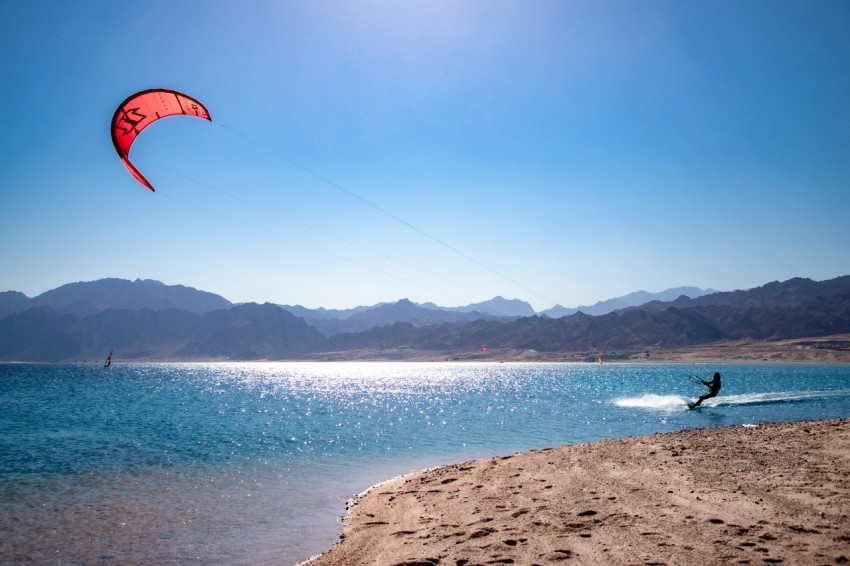 a person kite surfing on the sea