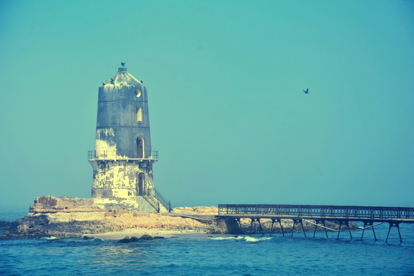 a lighthouse on a rocky island