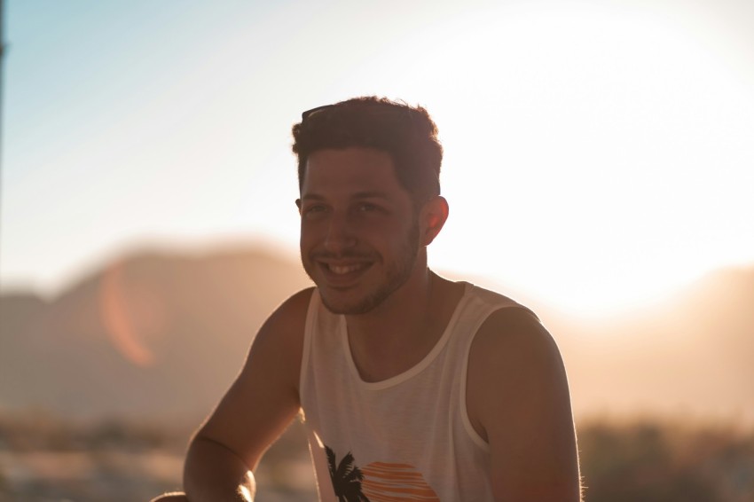 man in white tank top