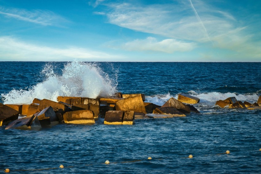 a wave crashing on rocks