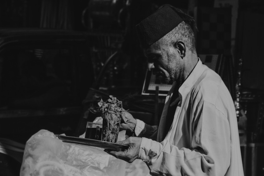 man in white dress shirt and black hat