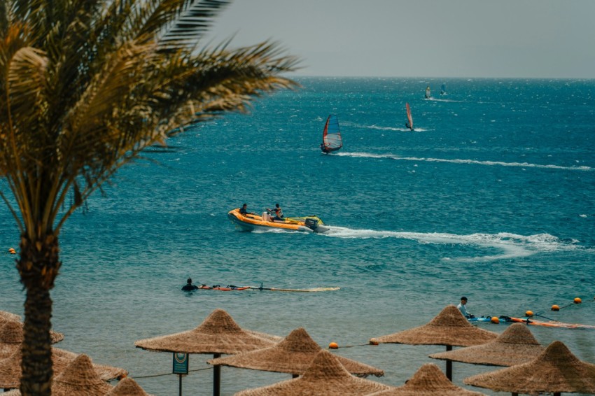 a group of people sail on the sea