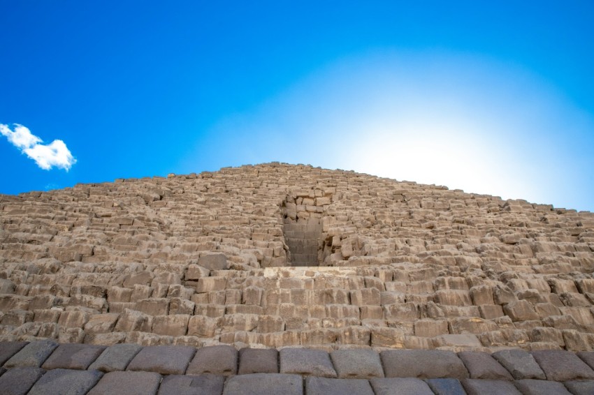 a stone wall with a blue sky