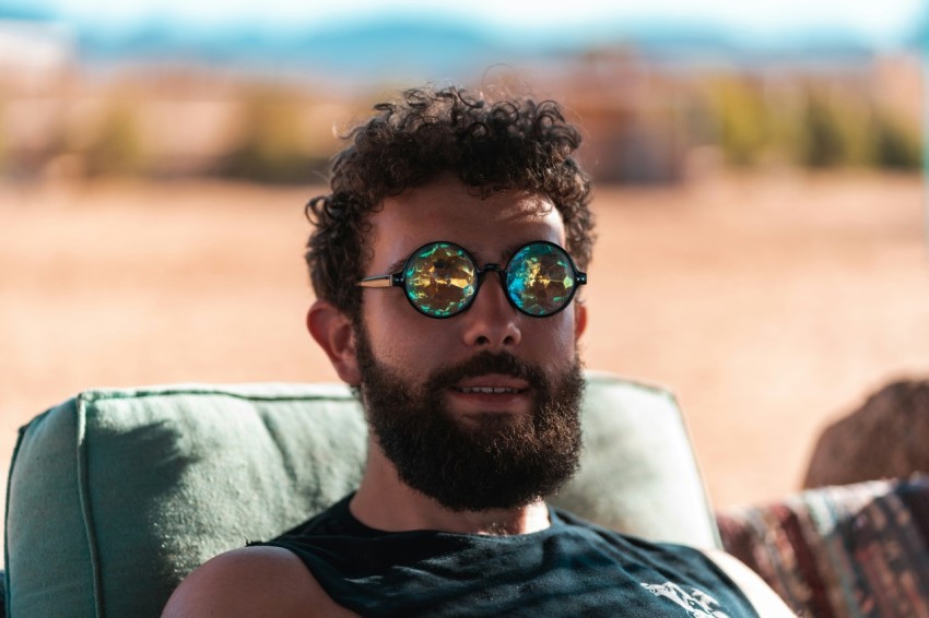 man in black tank top wearing black sunglasses