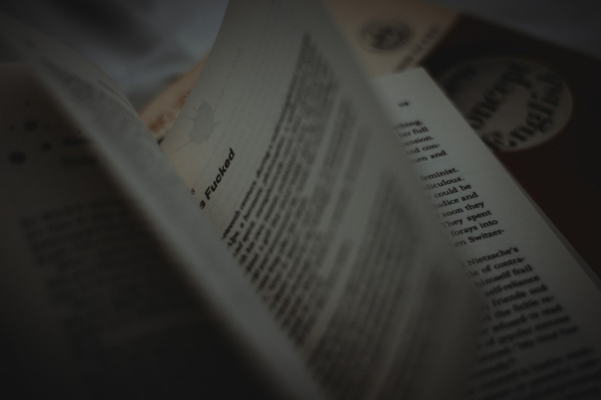 a close up of an open book on a table