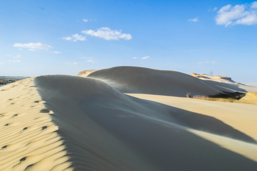 a large sand dune in the middle of a desert