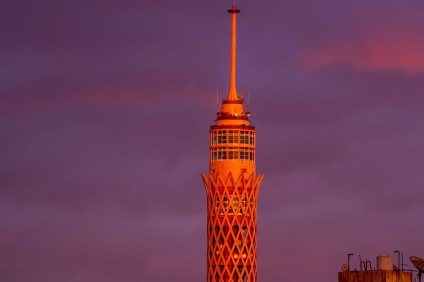 a very tall tower with a clock on its side