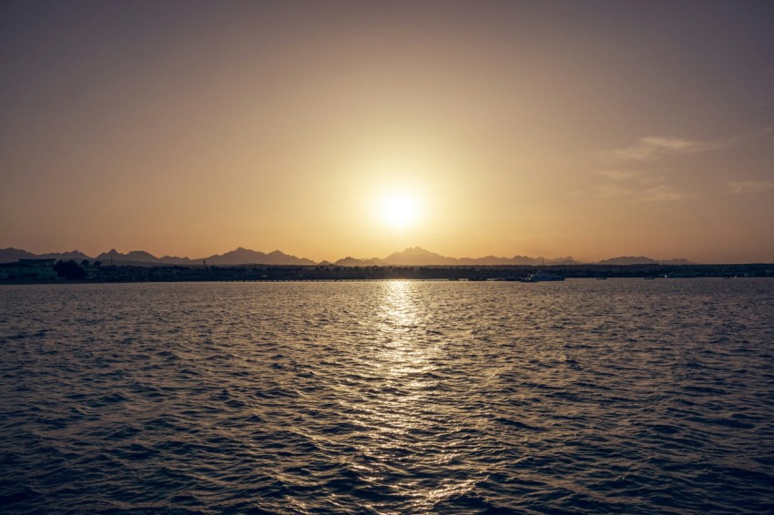 body of water during sunset