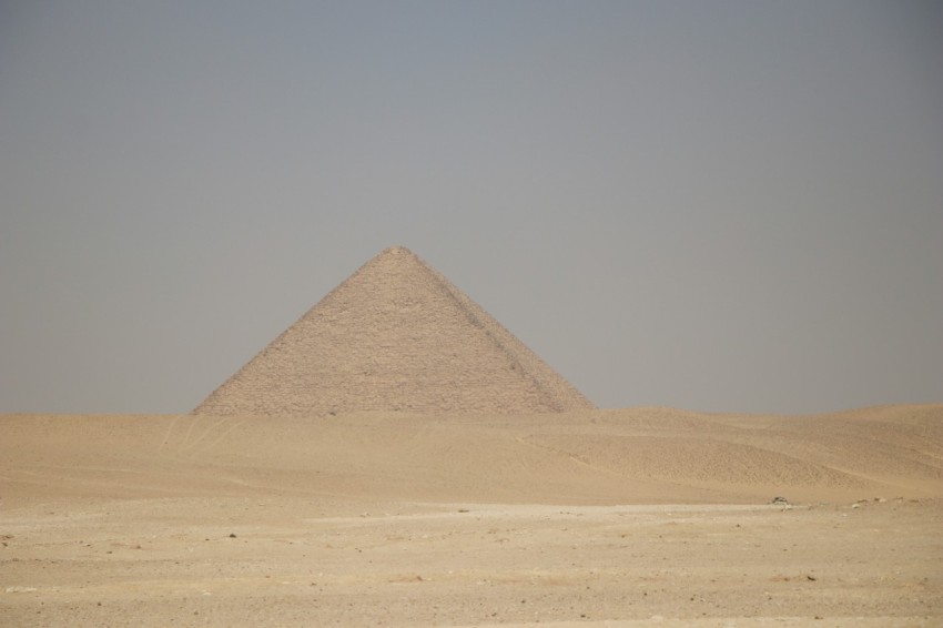 a very tall pyramid in the middle of a desert