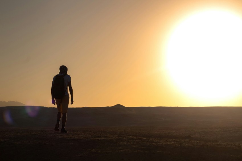 a person walking on a dirt road