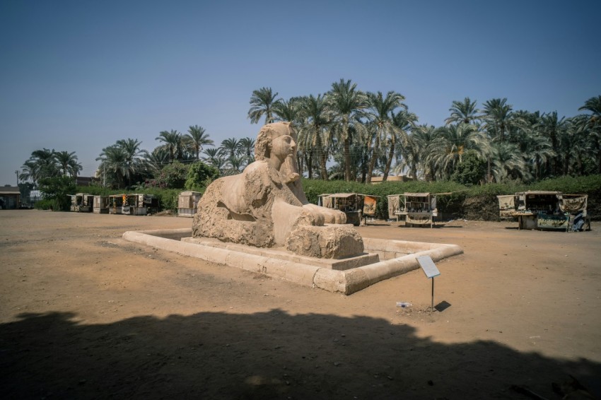 a large stone statue of a seated man