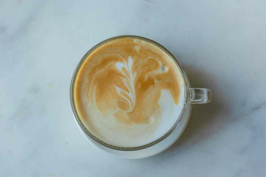 a cup of coffee on a marble table