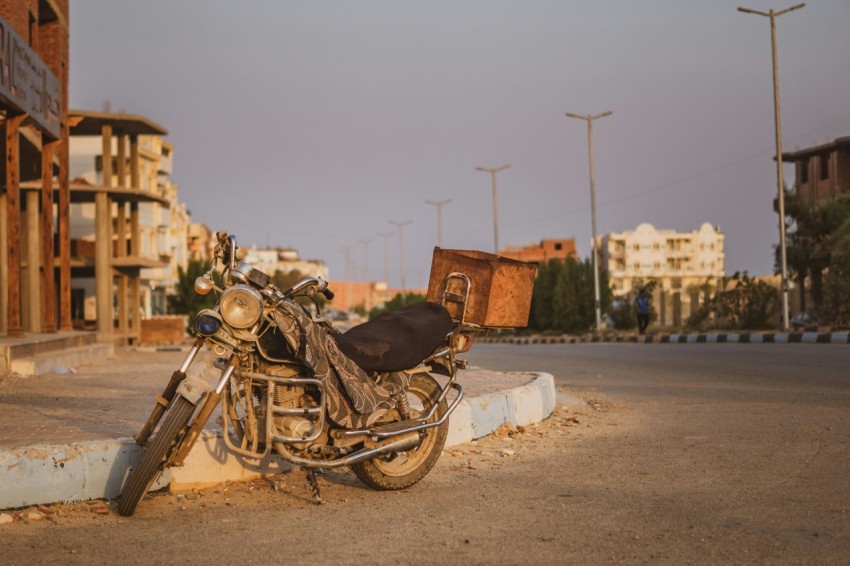 a motorcycle parked on the side of a road