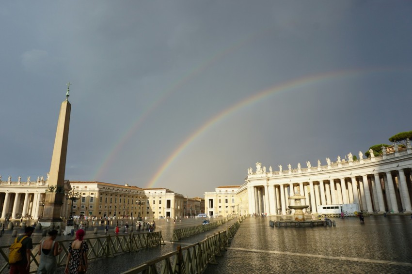 a rainbow in the sky over a city