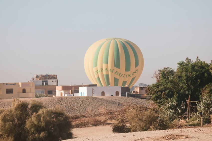 a large hot air balloon in the middle of a desert